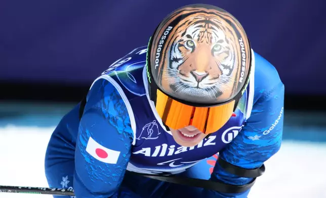 Gakuta Koike, of Japan, reacts after competing in the alpine skiing men's downhill standing competition at the 2026 Winter Paralympics, in Cortina d'Ampezzo, Italy, Saturday, March 7, 2026. (AP Photo/Emilio Morenatti)