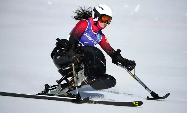 Liu Sitong, of China, competes in the alpine skiing women's downhill sitting competition at the 2026 Winter Paralympics, in Cortina d'Ampezzo, Italy, Saturday, March 7, 2026. (AP Photo/Emilio Morenatti)