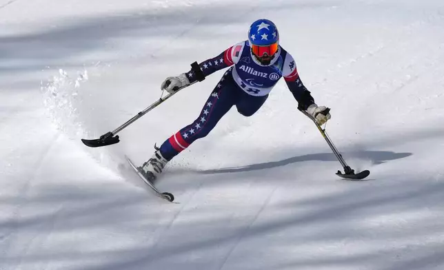 Patrick Halgren, of the United States, competes in the alpine skiing men's super-G standing final at the 2026 Winter Paralympics, in Cortina d'Ampezzo, Italy, Monday, March 9, 2026. (AP Photo/Evgeniy Maloletka)