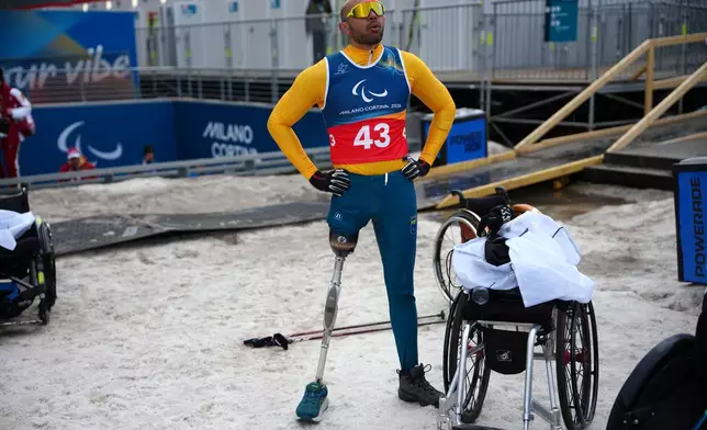 Robelson Lula, of Brazil, stands after competing in the cross country skiing men's 10Km interval start sitting final at the 2026 Winter Paralympics, in Tesero, Italy, Wednesday, March 11, 2026. (AP Photo/Emilio Morenatti)