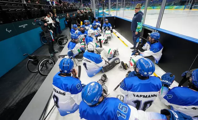 Italian players get ready prior to the Group A hockey match between Italy and China at the 2026 Winter Paralympics, in Milan, Italy, Monday, March 9, 2026. (AP Photo/Luca Bruno)