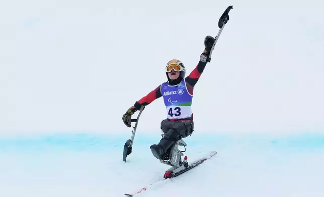 Anna-Lena Forster, of Germany, reacts after crossing the finish line to win the gold medal in the alpine skiing women's giant slalom sitting at the 2026 Winter Paralympics, in Cortina d'Ampezzo, Italy, Thursday, March 12, 2026. (AP Photo/Evgeniy Maloletka)