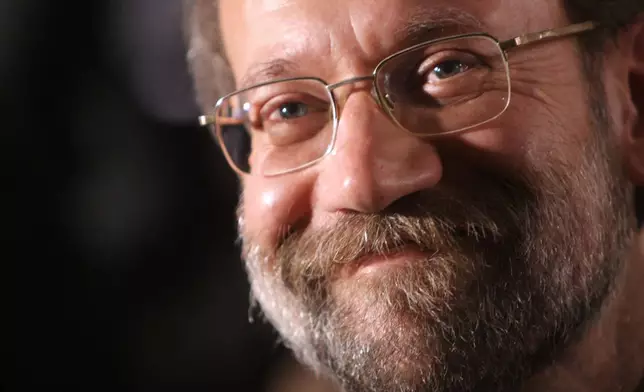 FILE - Iran's chief nuclear negotiator Ali Larijani, smiles as he attends in a ceremony at Iran's nuclear enrichment facility in Natanz, 300 kms 186 (miles) south of capital Tehran, Iran, Monday April, 9, 2007. (AP Photo/Hasan Sarbakhshian, File)