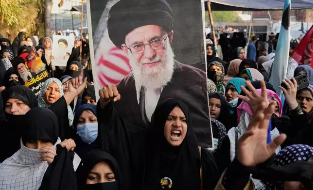Shiite Muslims chant anti U.S slogans during a rally to condemn the killing of Iranian Supreme Leader Ayatollah Ali Khamenei, in Lahore, Pakistan, Sunday, March 1, 2026. (AP Photo/K.M. Chaudary)