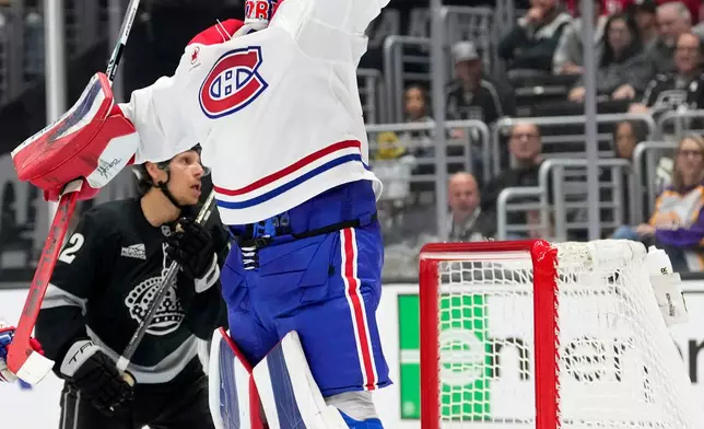 Montréal Canadiens goaltender Jakub Dobes jumps for the puck during the second period of an NHL hockey game against the Los Angeles Kings, Saturday, March 7, 2026, in Los Angeles. (AP Photo/Mark J. Terrill)