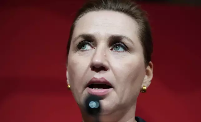 Danish Prime Minister Mette Frederiksen speaks to members of her Social Democratic Party in the Danish Parliament in Copenhagen, Denmark, after the General Election on Tuesday, March 24, 2026. (AP Photo/Sergei Grits)