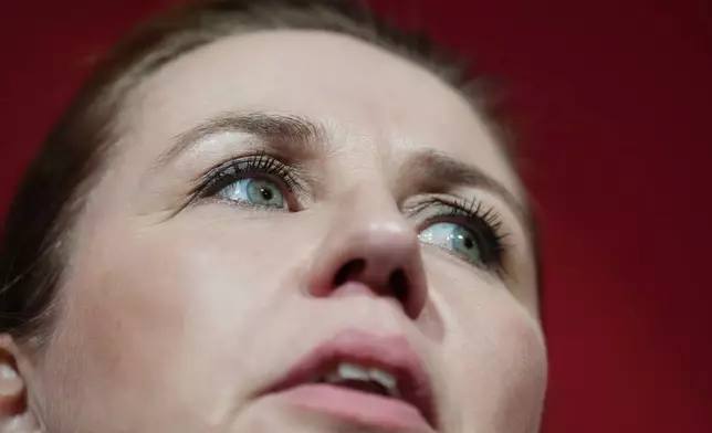 Danish Prime Minister Mette Frederiksen speaks to members of her Social Democratic Party in the Danish Parliament in Copenhagen, Denmark, after the General Election on Tuesday, March 24, 2026. (AP Photo/Sergei Grits)