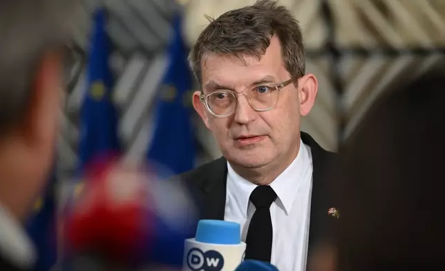 FILE - Denmark's Defense Minister Troels Lund Poulsen speaks with the media as he arrives for a meeting of European Union defense ministers at the European Council building in Brussels, Feb. 11, 2026. (AP Photo/Harry Nakos, File)