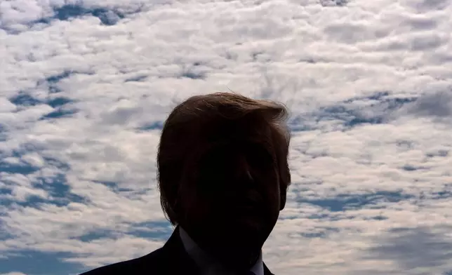 President Donald Trump speaks with reporters before departing on Marine One from the South Lawn of the White House, Wednesday, March 11, 2026, in Washington. (AP Photo/Alex Brandon)