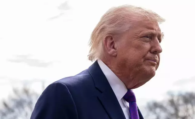 President Donald Trump speaks with reporters before departing on Marine One from the South Lawn of the White House, Wednesday, March 11, 2026, in Washington. (AP Photo/Alex Brandon)