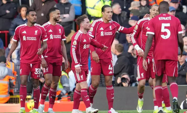 Liverpool players celebrate after a goal during the Premier League soccer match between Liverpool and West Ham United in Liverpool, England, Saturday, Feb. 28, 2026. (AP Photo/Jon Super)