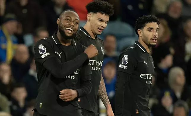 Manchester City's Antoine Semenyo, left, reacts after scoring during the Premier League soccer match between Leeds United and Manchester City in Leeds, England, Saturday, Feb. 28, 2026. (AP Photo/Ian Hodgson)