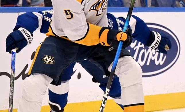 Nashville Predators left wing Filip Forsberg (9) handles the puck during the first period of an NHL hockey game against the Tampa Bay Lightning, Sunday, March 29, 2026, in Tampa, Fla. (AP Photo/Jason Behnken)