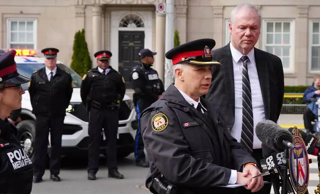 Frank Barredo, deputy chief of the Toronto Police Service, speaks outside the U.S. consulate during a news conference as Chief Superintendent Chris Leather, right, the officer in charge of criminal operations for the Royal Canadian Mounted Police, looks on, Tuesday, March 10, 2026, in Toronto. (Frank Gunn/The Canadian Press via AP)