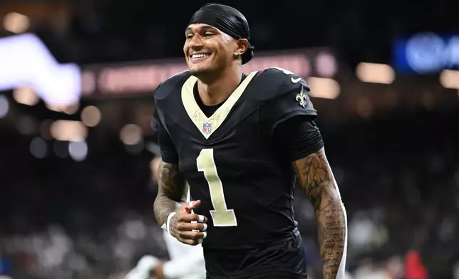 FILE- New Orleans Saints cornerback Alontae Taylor runs off the field before an NFL football game against the New England Patriots, Oct. 12, 2025, in New Orleans. (AP Photo/Ella Hall, File)