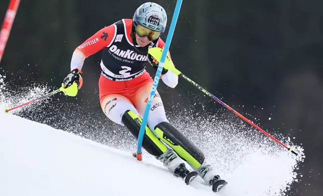 Switzerland's Wendy Holdener is airborne during an alpine ski, women's downhill training, at the Lillehammer World Cup Finals, in Kvitfjell, Norway, Friday, March 20, 2026. (AP Photo/Marco Trovati)