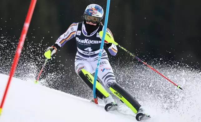 Germany's Emma Aicher competes in an alpine ski, women's slalom race, at the Lillehammer World Cup Finals, in Hafjell, Norway, Tuesday, March 24, 2026. (AP Photo/Marco Trovati)