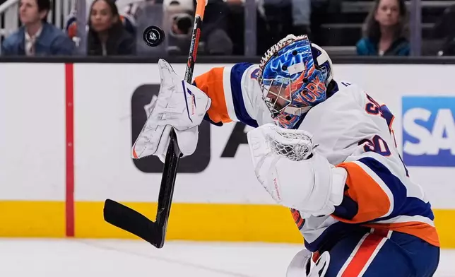 New York Islanders goaltender Ilya Sorokin (30) deflects a shot during the third period of an NHL hockey game against the San Jose Sharks, Saturday, March 7, 2026, in San Jose, Calif. (AP Photo/Godofredo A. Vásquez)