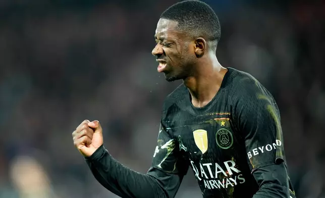 PSG's Ousmane Dembele celebrates after scoring his side's second goal during the first leg of the Champions League round of 16 soccer match between Paris Saint-Germain and Chelsea, in Paris, Wednesday, March 11, 2026. (AP Photo/Michel Euler)