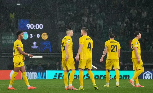 Bodo Glimt players react during a Champions League round of 16 second leg soccer match between Sporting CP and Bodo Glimt in Lisbon, Portugal, Tuesday, March 17, 2026. (AP Photo/Ana Brigida)