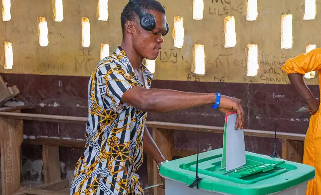 A voter cast his ballot at a polling station in Brazzaville, the Republic of Congo, Sunday, March 15, 2026. (AP Photo/Vivace Mambouana)