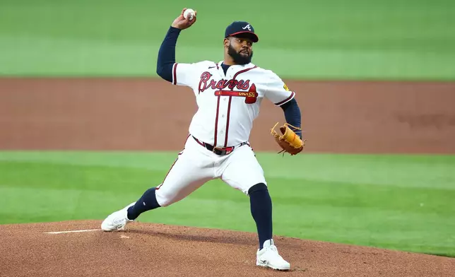 Atlanta Braves pitcher Reynaldo López delivers in the first inning of a baseball game against the Kansas City Royals, Saturday, March 28, 2026, in Atlanta. (AP Photo/Colin Hubbard)
