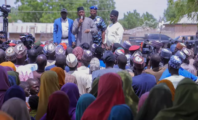 People listen to Babagana Zulum, the Borno state governor, in Pulka, Nigeria, Friday, March 6, 2026, after they fled an attack by Islamic militants in Ngoshe. (AP Photo/Jossy Ola)