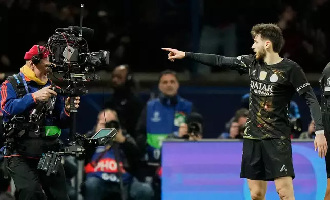 PSG's Khvicha Kvaratskhelia celebrates after scoring his side's fourth goal during the first leg of the Champions League round of 16 soccer match between Paris Saint-Germain and Chelsea, in Paris, Wednesday, March 11, 2026. (AP Photo/Michel Euler)