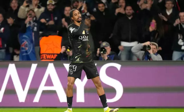 PSG's Bradley Barcola celebrates after scoring the opening goal during the first leg of the Champions League round of 16 soccer match between Paris Saint-Germain and Chelsea, in Paris, Wednesday, March 11, 2026. (AP Photo/Michel Euler)