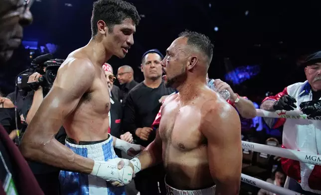 Sebastian Fundora, left, shakes hands with Keith Thurman after a super welterweight championship boxing match Saturday, March 28, 2026, in Las Vegas. (AP Photo/John Locher)