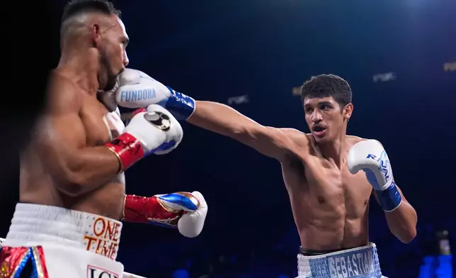 Sebastian Fundora hits Keith Thurman in a super welterweight championship boxing match Saturday, March 28, 2026, in Las Vegas. (AP Photo/John Locher)