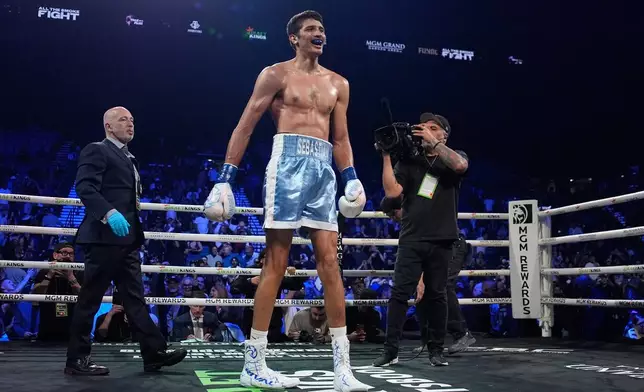 Sebastian Fundora celebrates after defeating Keith Thurman in a super welterweight championship boxing match Saturday, March 28, 2026, in Las Vegas. (AP Photo/John Locher)