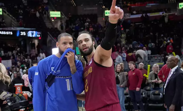 Cleveland Cavaliers guard Max Strus (2) talks with Dallas Mavericks forward Caleb Martin (16) after their NBA basketball game in Cleveland, Sunday, March 15, 2026. (AP Photo/Sue Ogrocki)