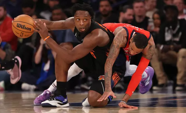New York Knicks OG Anunoby (8) defends the ball from New Orleans Pelicans Dejounte Murray (5) during the first half of an NBA basketball game Tuesday, March 24, 2026, in New York. (AP Photo/Pamela Smith)