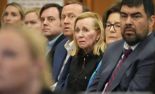 Camp Mystic owner Tweety Eastland, center, attends a hearing about a temporary restraining order regarding the camp, at the Travis County Courthouse in Austin, Texas, on Wednesday, March 4, 2026. (Jay Janner/Austin American-Statesman via AP, Pool)