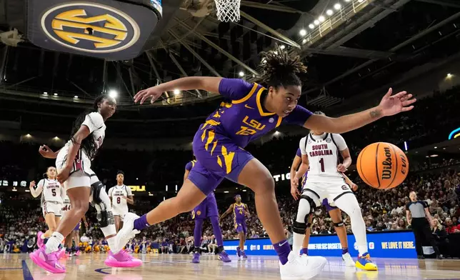 LSU guard Mikaylah Williams goes after a loose ball against South Carolina during the first half of an NCAA college basketball game in the semifinals of the Southeastern Conference tournament, Saturday, March 7, 2026, in Greenville, S.C. (AP Photo/Chris Carlson)