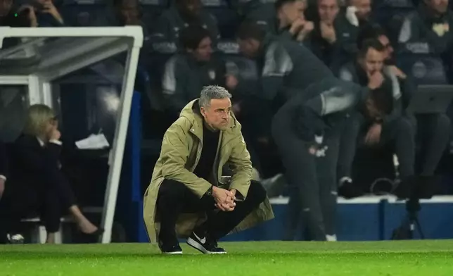 PSG's head coach Luis Enrique watches at the sideline during the French League One soccer match between Paris Saint-Germain and Monaco in Paris, Friday, March 6, 2026. (AP Photo/Thibault Camus)