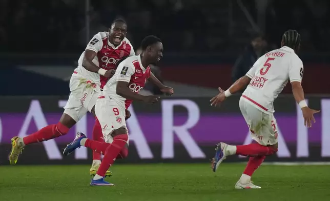 Monaco's Folarin Balogun (9) celebrates scoring his side's 3rd goal during the French League One soccer match between Paris Saint-Germain and Monaco in Paris, Friday, March 6, 2026. (AP Photo/Thibault Camus)
