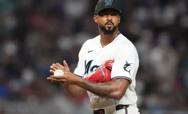 Miami Marlins pitcher Sandy Alcantara stand son the mound during the fourth inning of a baseball game against the Colorado Rockies, Friday, March 27, 2026, in Miami. (AP Photo/Lynne Sladky)