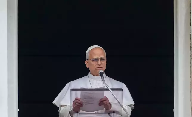 Pope Leo XIV appears at the window of his studio overlooking St. Peter's Square at the Vatican where Catholic faithful and pilgrims gathered for the traditional Sunday blessing at the end of the noon Angelus prayer, Sunday, March 15, 2026. (AP Photo/Andrew Medichini)