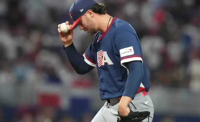 United States pitcher Paul Skenes pauses on the mound during the third inning of a World Baseball Classic semifinal game against the Dominican Republic, Sunday, March 15, 2026, in Miami. (AP Photo/Lynne Sladky)
