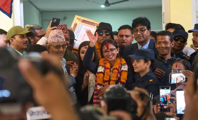 Supporters of Rastriya Swatantra Party celebrate the victory of Toshima Karki, a candidate for a seat in the House of Representatives in Lalitpur, Nepal, Saturday, March 7, 2026. (AP Photo/Niranjan Shrestha)