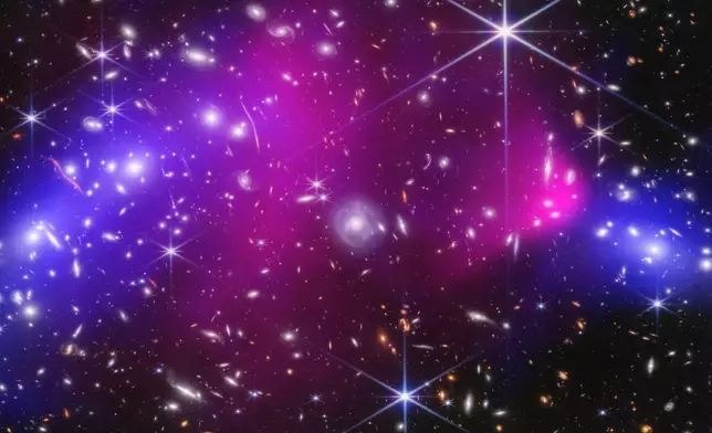 FILE - This image provided by NASA shows two massive galaxy clusters captured by NASA's James Webb Space Telescope and Chandra X-ray Observatory in Jan. 20, 2025, with areas of possible dark matter indicated in blue. (NASA, ESA, CSA, STScI, CXC; Science: James Jee (Yonsei University, UC Davis), Sangjun Cha (Yonsei University), Kyle Finner (Caltech/IPAC) via AP, File)