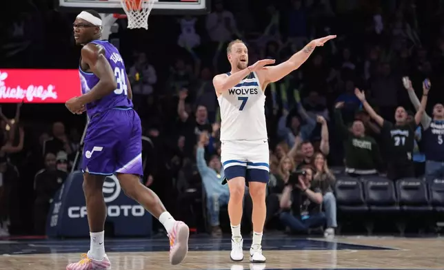 Minnesota Timberwolves forward Joe Ingles (7) celebrates after making a 3-point shot during the second half of an NBA basketball game against the Utah Jazz, Wednesday, March 18, 2026, in Minneapolis. (AP Photo/Abbie Parr)