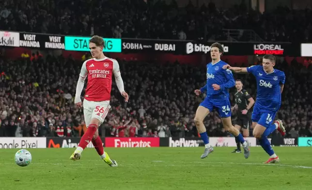 Arsenal's Max Dowman scores during the English Premier League soccer match between Arsenal and Everton in London, England, Saturday, March 14, 2026. (AP Photo/Kin Cheung)