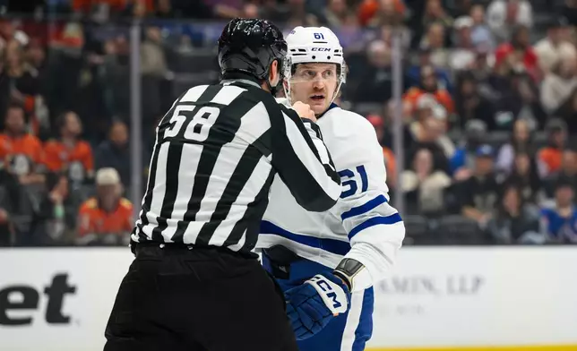 Toronto Maple Leafs left wing Michael Pezzetta (61) receives a game misconduct and is ejected during the second period of an NHL hockey game against the Anaheim Ducks, Monday, March 30, 2026, in Anaheim, Calif. (AP Photo/William Liang)