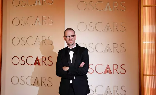 Joachim Trier arrives at the Oscars on Sunday, March 15, 2026, at the Dolby Theatre in Los Angeles. (Photo by Jordan Strauss/Invision/AP)