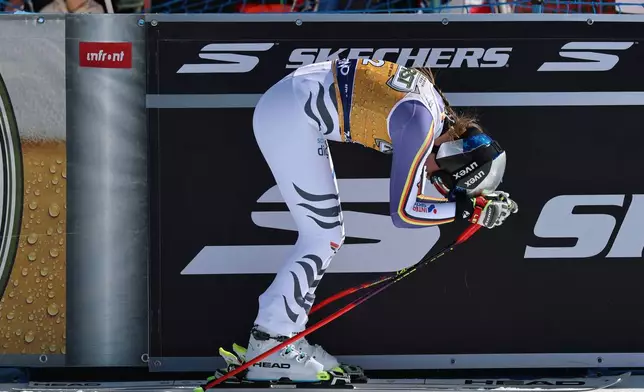 Germany's Emma Aicher reacts at the finish area of an alpine ski, women's World Cup downhill, in Val di Fassa, Italy, Saturday, March 7, 2026. (AP Photo/Marco Trovati)