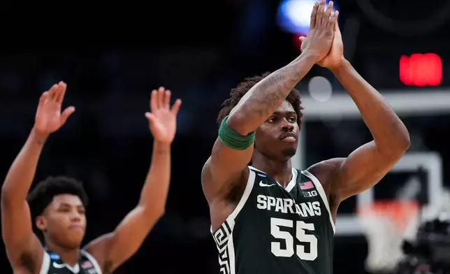Michigan State forward (55) waves to fans after the second half in the Sweet 16 of the NCAA college basketball tournament against UConn, Saturday, March 28, 2026, in Washington. (AP Photo/Stephanie Scarbrough)