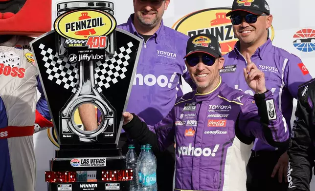 Denny Hamlin poses with his trophy in Victory Lane after winning a NASCAR Cup Series auto race at, Sunday, March 15, 2026, in Las Vegas. (AP Photo/Steve Marcus)